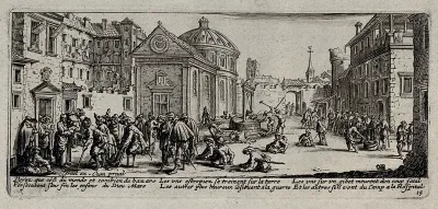 Maimed soldiers dragging themselves to a hospital