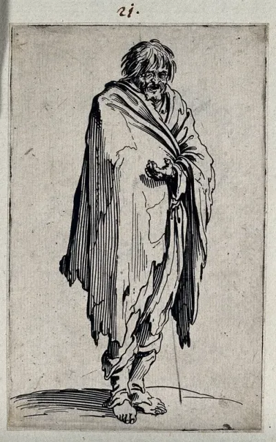 Male beggar dressed in rags