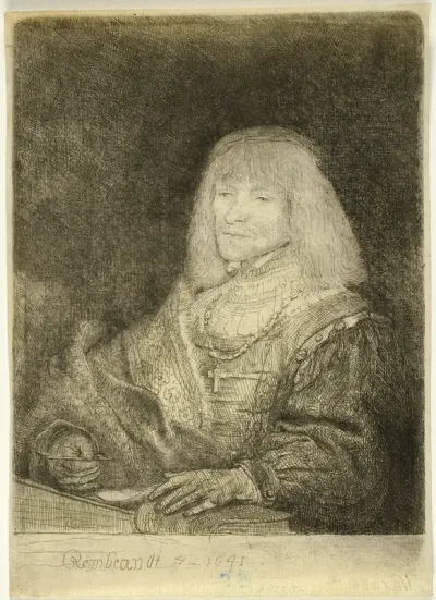 Man at a Desk Wearing a Cross and Chain