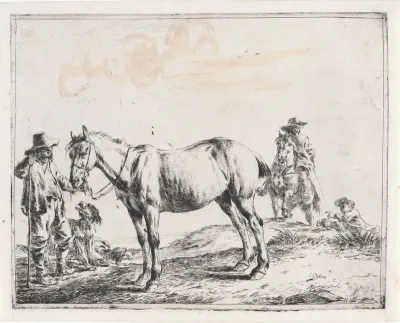 Man houdt een paard bij de teugels