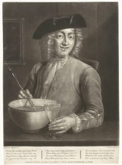 Man met een glas en een schaal