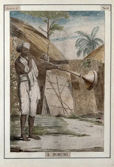 Man playing a borung, a type of horn played at Hindu festivals, Calcutta, West Bengal