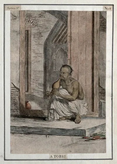 Man seated in doorway playing the tobri, a wind instrument, Calcutta, West Bengal