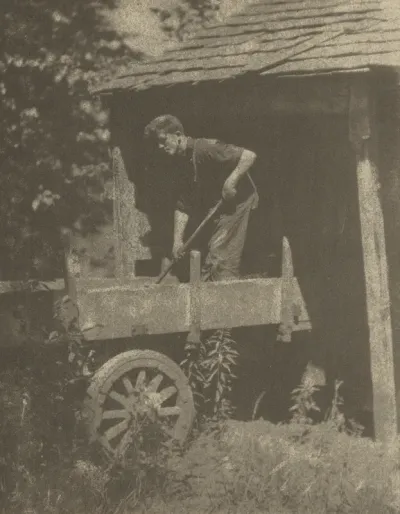 Man Shoveling Corn near Andrews, North Carolina