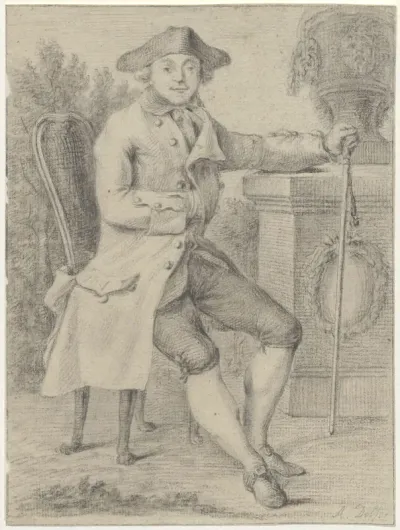 Man sitting in a park, holding a cane