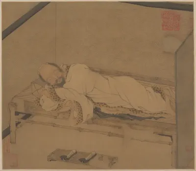 Man sleeping on a bamboo couch