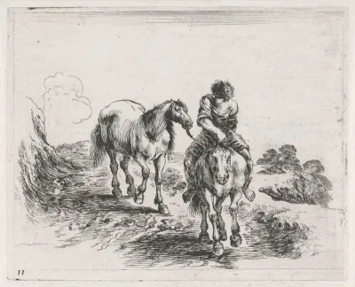 Man te paard voert een ander paard mee