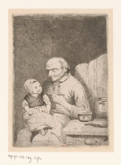 Man voert het kind dat bij hem op schoot zit