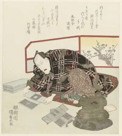 Man vouwt miniatuur kimono`s