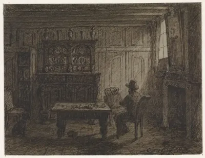 Man zittend in een kamer