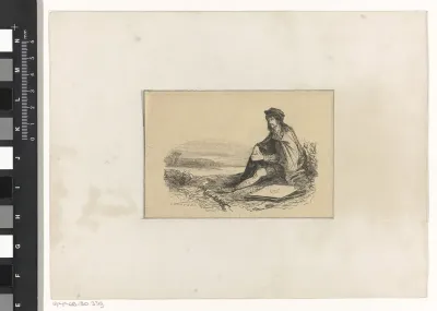 Man zittend in het gras aan de waterkant