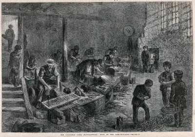 Men and boys working in a fork-grinding factory in Sheffield