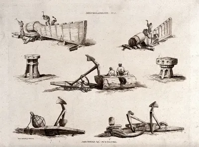 Men are working on the side of a wooden boat; anchors, a buoy and anchoring rope are lying around
