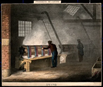 Men dyeing cotton blue and red
