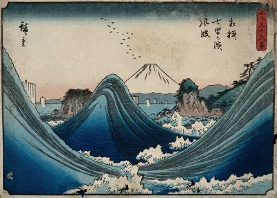 Mount Fuji seen through the waves at Manazato no hama, in the Izu Penisula, south of the mountain