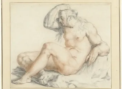 Naakte zittende vrouwenfiguur