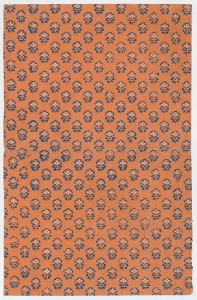 Orange book cover with overall floral pattern