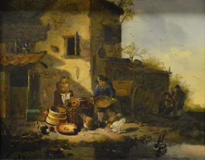 Paysan donnant à manger à des poules