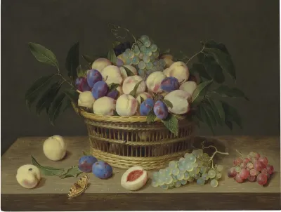 Peaches, plums and grapes in a wicker basket, with fruit and a butterfly on a wooden table