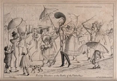 People walking along the Strand in London holding umbrellas and carrying luggage, leading to accidents and commotion in the street