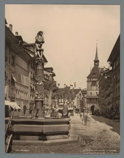 Pfeiferbrunnen in Bern, verderop de Käfigturm