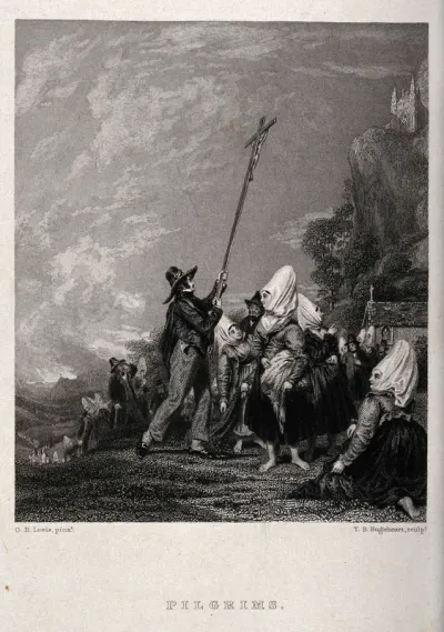 Pilgrims raising a cross at a mountainous shrine in Austria