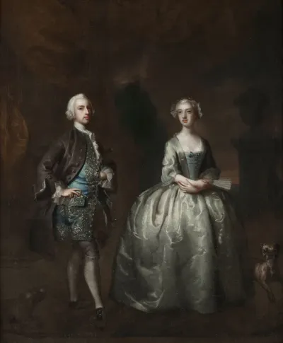 Portrait of a gentleman and his wife, standing on a terrace with dogs at their feet