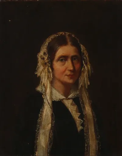 Portrait of a lady with a white lace bonnet.
