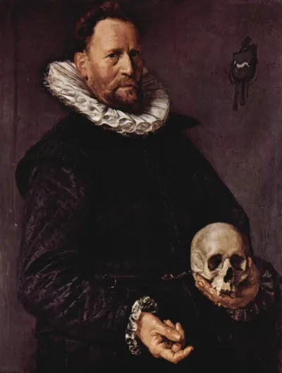 Portrait of a man holding a skull