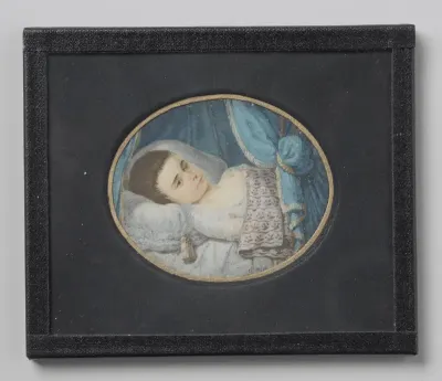 Portret van een ziek meisje in bed liggend