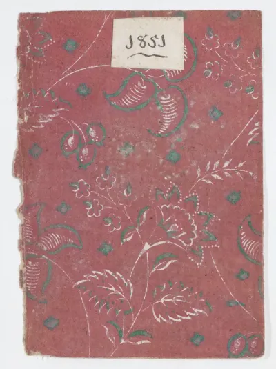 Red book cover with floral and vine pattern