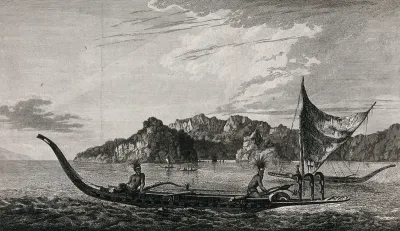 Resolution Bay in the Marquesas Islands: canoes and a sailing boat in the harbour