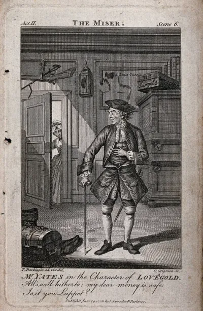 Richard Yates in character as the miser Lovegold standing in a room of his London townhouse as a maid enters