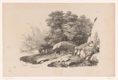 Rotslandschap met pad langs bomen en rivier