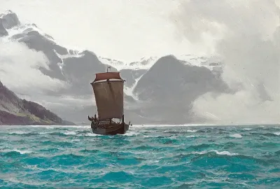 Sailing ship off a snow-covered coast.