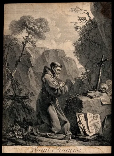 Saint Francis of Assisi in wilderness, kneeling in front of a crucifix