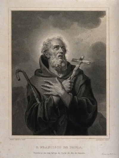 Saint Francis of Paula holding a crucifix, looking towards the sky, with the word Charitas