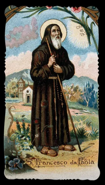 Saint Francis of Paula holding his walking stick with both hands and looking at the sun; church and mountains in the background