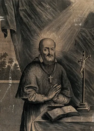 Saint Francis of Sales praying behind an altar