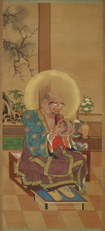 Seated arhat with rosary, one of a pair