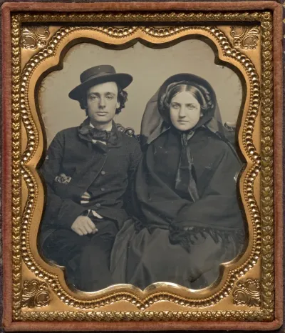 Seated couple in mourning attire
