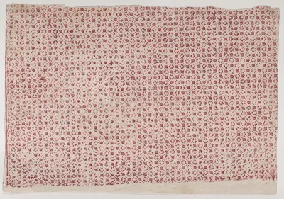 Sheet with a red geometric and floral pattern