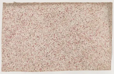 Sheet with an overall red speckle pattern