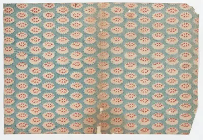 Sheet with overall pattern of ovals with red designs