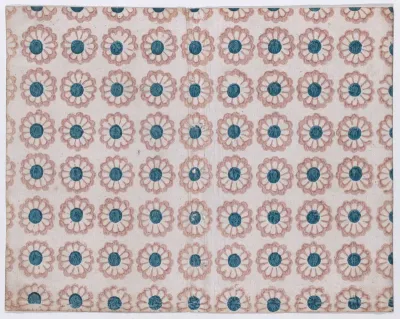 Sheet with overall pattern of pink flowers with blue centers