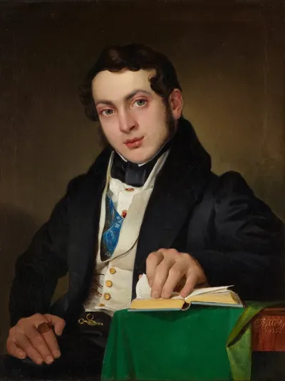 Sitting young man in a black frock coat