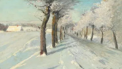 Snow covered landscape by a road.
