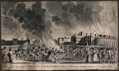 St George's Fields, Southwark: anti-Catholic rioters in the Gordon riots wielding sticks, displaying banners, and setting buildings on fire