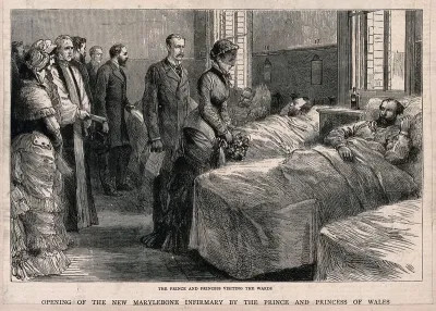 St Marylebone Infirmary, Exmoor Street, London: the Prince and Princess of Wales visiting patients in one of the wards