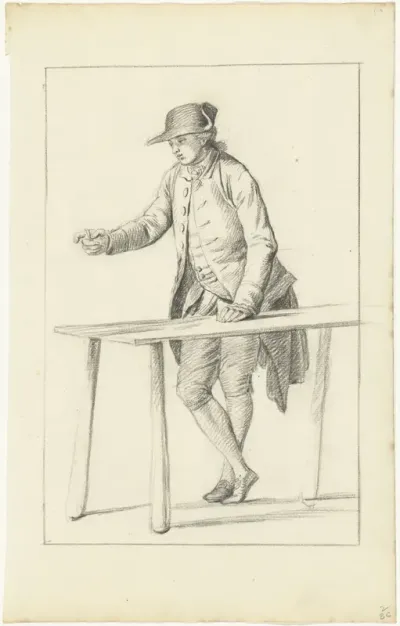 Staande, wijzende man bij tafel